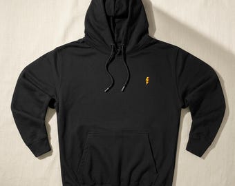 Sudadera con capucha bordada con rayo, estilo urbano vintage negro de tejido grueso, corte holgado.