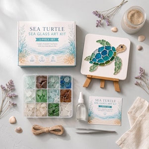 May include: A sea turtle sea glass art kit including a box, a finished sea turtle mosaic on a small wooden easel, a twelve-compartment plastic container filled with assorted sea glass, a bottle of adhesive, metal tweezers, and twine.
