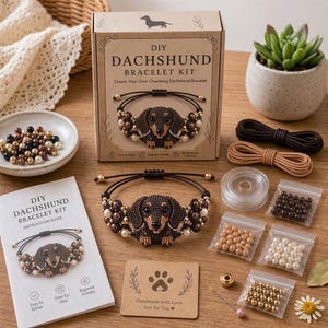 May include: A DIY dachshund bracelet kit including a cardboard box with product text, an instruction guide, a finished beaded dachshund bracelet, two spools of cord, and several small plastic bags containing brown, white, and gold beads.