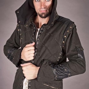 May include: A dark green hooded jacket with black leather accents and silver eyelets. The jacket has a zip fastening and two pockets on the front.