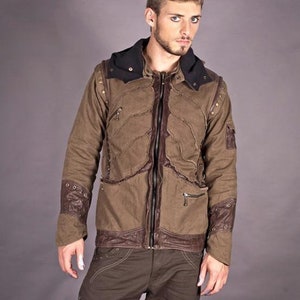 May include: A brown hooded jacket with leather accents and a zip closure. The jacket has a distressed look and features multiple pockets.