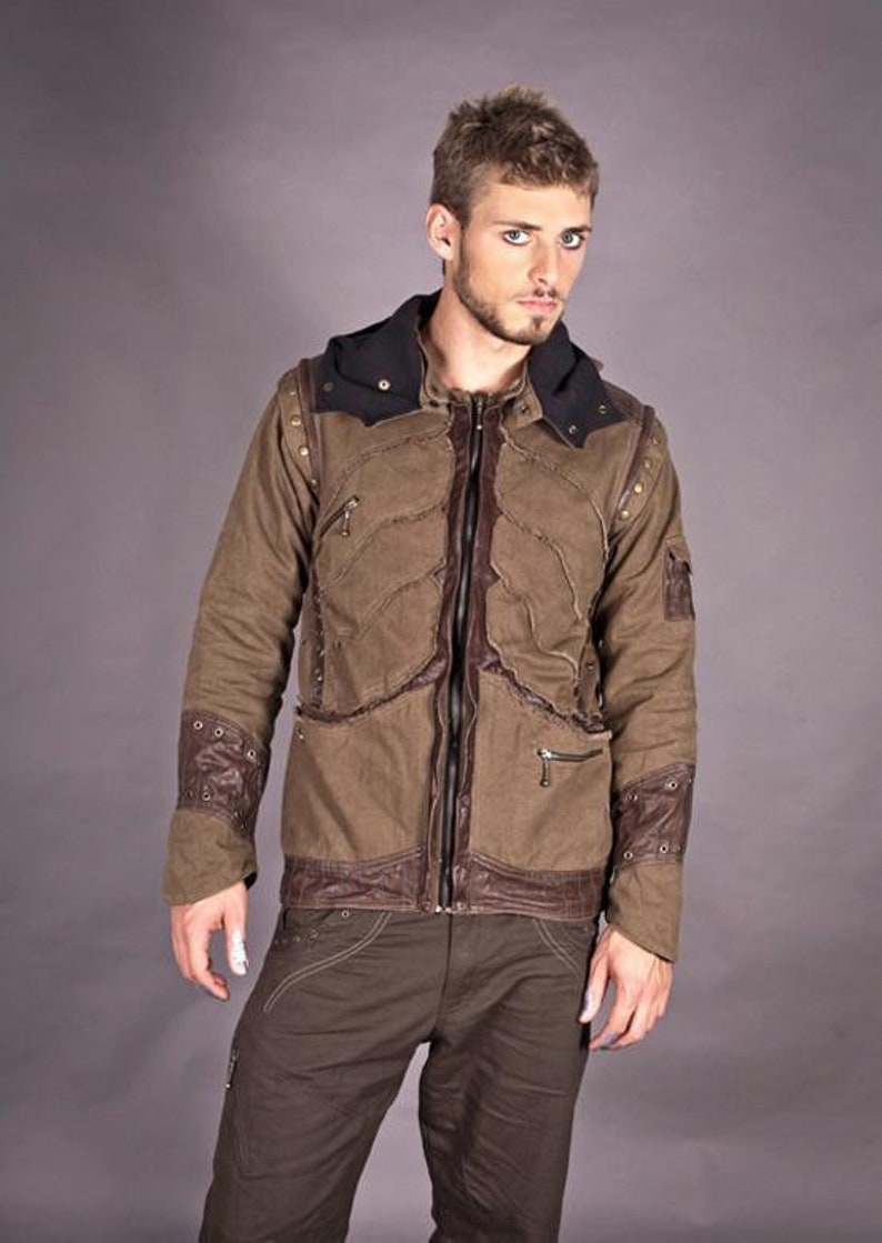May include: A brown hooded jacket with leather accents and a zip closure. The jacket has a distressed look and features multiple pockets.