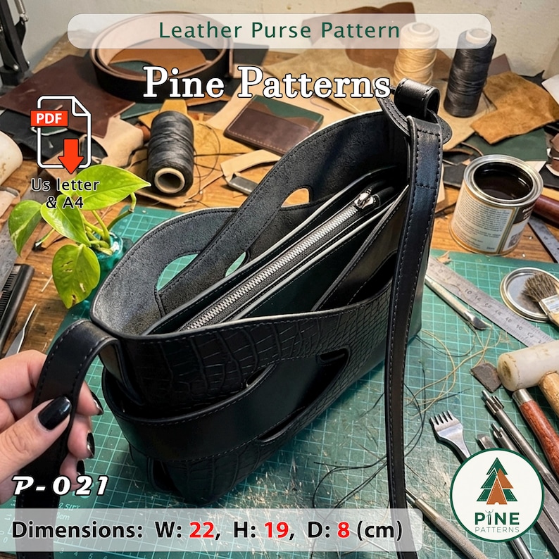 May include: A black leather purse with a crocodile texture, featuring a long strap and a zippered interior. The purse measures 22 cm wide, 19 cm high, and 8 cm deep. The image includes the text "Leather Purse Pattern" and "Pine Patterns".