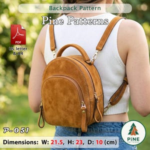 May include: A brown suede mini backpack with a top handle, a front zippered pocket, and adjustable shoulder straps. The digital pattern file is labeled Pine Patterns P-051, available in US letter and A4 formats, measuring 21.5 cm W x 23 cm H x 10 cm D.