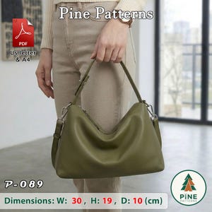 May include: An olive green hobo bag with a single shoulder strap and silver-tone hardware. The bag features a smooth finish and a curved silhouette. Text on the image includes Pine Patterns, P-089, and dimensions of 30 cm by 19 cm by 10 cm.