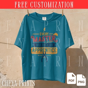 May include: A teal short-sleeve t-shirt featuring a graphic print with a yellow lightning bolt, a yellow hard hat, and the text "EVERY MASTER WAS ONCE AN APPRENTICE" in red, white, and yellow, along with a pair of pliers at the bottom.