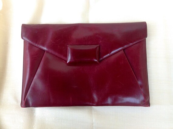 Items similar to Vintage 40s burgundy envelope leather clutch on Etsy