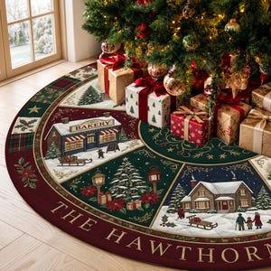 May include: A circular Christmas tree skirt featuring a segmented design with illustrations of a bakery, a snow-covered house, and a decorated tree. The border is deep red with the text THE HAWTHORN printed in gold, accented by holly and plaid patterns.