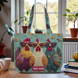 May include: A turquoise tote bag featuring three cartoon chickens wearing sunglasses. The chickens are in shades of purple, yellow, and teal. The bag has a floral pattern on the handles and a label that says "YOUR NAME".