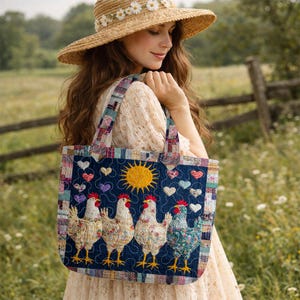May include: A quilted tote bag with a navy blue background featuring a sun, hearts, and four chickens. The bag has a patchwork design with a matching strap. The tote is carried over the shoulder.