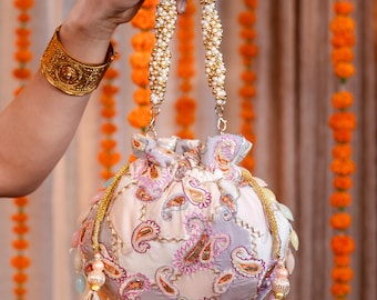Embroidered Silk Potli Bag: Bridal Clutch with Pearl Handle & Paisley
