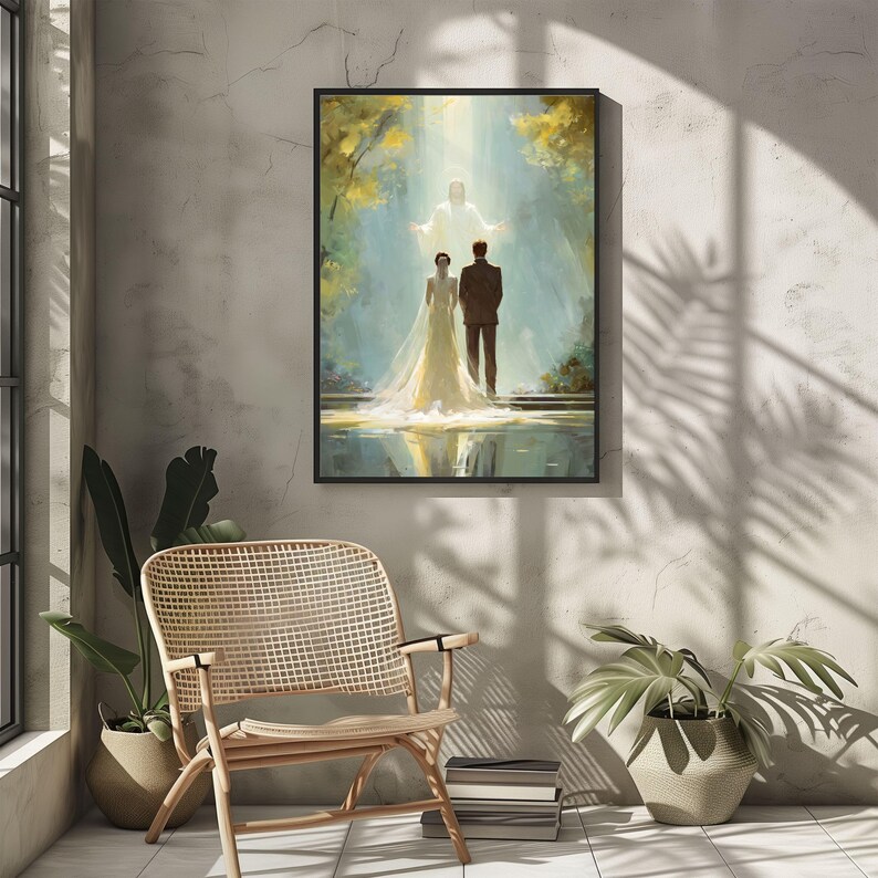 May include: A framed art print depicts a couple standing before a bright light, with a figure in the light. The couple is dressed in wedding attire. The artwork is set against a backdrop of trees and water, with a black frame.