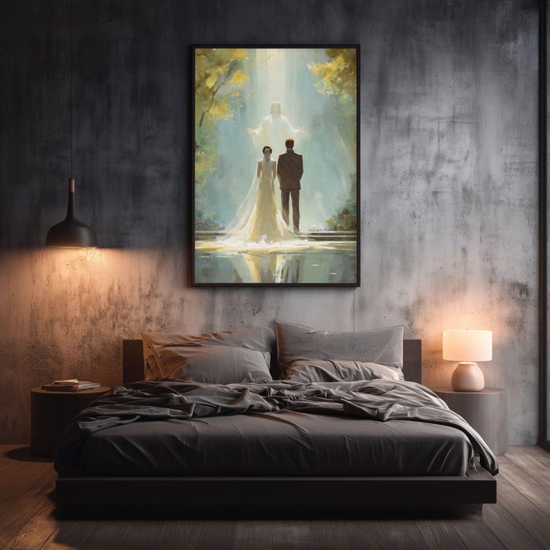 May include: A framed artwork depicting a wedding scene. The painting shows a couple standing before a figure in a bright light. The artwork is displayed above a bed with gray bedding, a black bed frame, and two side tables with lamps.