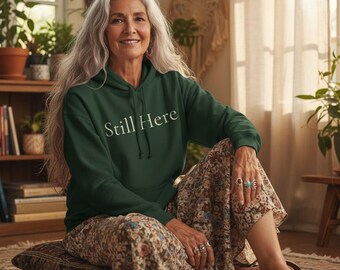 Still Here Minimal Political Message Hoodie Forest Green Cream Trim