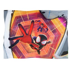 May include: A blanket featuring a dynamic illustration of Spider-Man in a red and black suit, with a second character in a red and blue suit. The background showcases a geometric, orange and purple tunnel design.