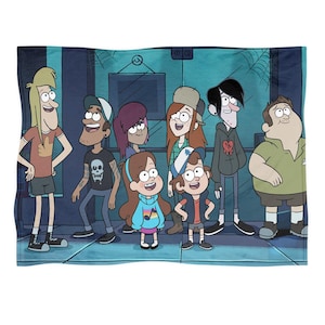 Könnte beinhalten: Eine türkisfarbene Decke mit einem Cartoon-Bild von Charakteren aus der Zeichentrickserie Gravity Falls. Die Charaktere stehen in einer Reihe, mit einem dunkelblauen Hintergrund. Die Decke ist rechteckig und scheint aus einem weichen Material zu sein.