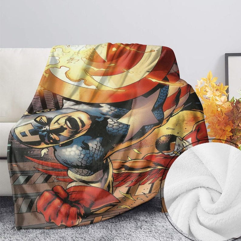 Peut inclure: Une couverture en polaire avec une illustration de bande dessin&eacute;e de Captain America. La couverture pr&eacute;sente des couleurs vives, notamment du rouge, du bleu, du jaune et du blanc. Le design comprend le bouclier et le costume de Captain America, avec un gros plan du tissu blanc.