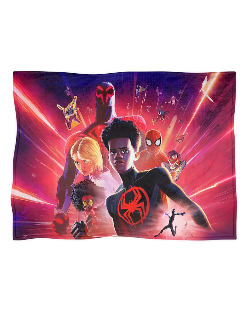 May include: A rectangular blanket featuring a vibrant illustration of multiple Spider-Man characters against a red and purple background. The design includes various figures in action poses, with a prominent spider emblem.
