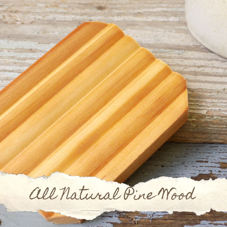 May include: A natural wood soap dish made from pine. The dish has a grooved design to help drain water.