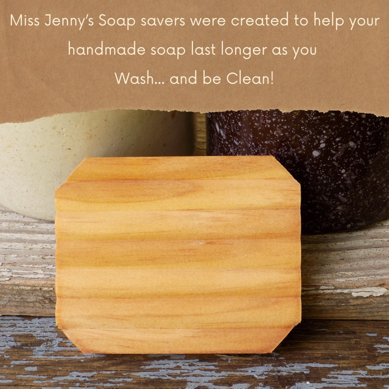 May include: A wooden soap saver with a rounded edge. The soap saver is made of light brown wood and has a natural wood grain. The soap saver is sitting on a wooden surface.