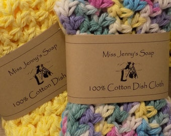 May include: Two crocheted dishcloths, one yellow and one multicolored, with brown paper tags that read "Miss Jenny's Soap 100% Cotton Dish Cloth"