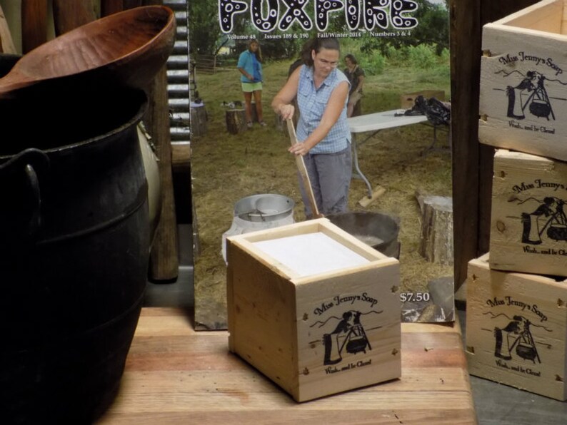May include: A wooden box with a white label that reads "Miss Jenny's Soap" and "Wash...and be Cleaned". The box is sitting on a wooden surface. The price tag reads "$7.50".