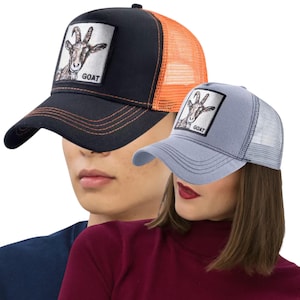 May include: Two baseball caps with a goat patch. One cap is black with an orange mesh back, the other is light blue with a white mesh back. Both caps have a curved brim and the word "GOAT" on the patch.