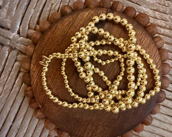 Gold stack beaded bracelets