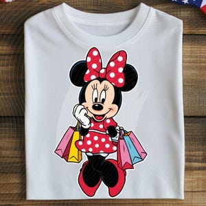 May include: White crew neck sweatshirt featuring a Minnie Mouse graphic. Minnie is depicted in a red polka dot dress and bow, holding shopping bags. The design is colorful and playful, perfect for Disney fans.