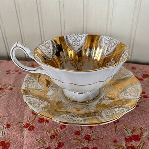 Vintage teacup and saucer, gold design, marked QueenAnne, bone China, England