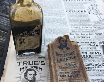 Antique bottle and copy of ad 1890s True Family Laxative and worm expeller