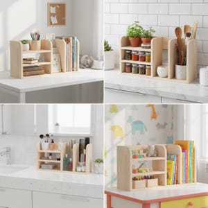 May include: A light-colored wooden desk organizer with multiple shelves and compartments. The organizer is designed to hold books, office supplies, and decorative items. The design is simple and modern, suitable for various rooms.