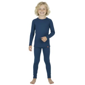 May include: A child wearing a matching navy blue long-sleeved shirt and leggings set. The shirt has a crew neck and a small red logo near the hem. The leggings are form-fitting. The child is smiling and standing against a white background.