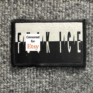 May include: A rectangular patch with a black and white split design. The top half is white and the bottom half is black. The text "FUCK ICE" is printed across the center in a stylized font, with the letters split horizontally between the two colors.