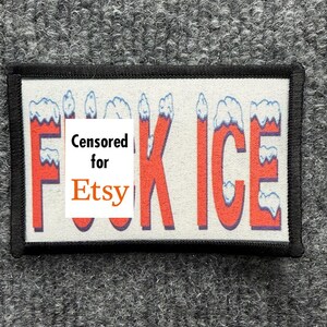 May include: A rectangular patch with a black border on a light background. The text reads FUCK ICE in red letters with white snow-like caps on top of each letter. A white rectangular overlay with the black and orange text Censored for Etsy covers part of the design.