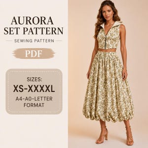 May include: Aurora Set Pattern sewing pattern PDF in sizes XS-XXXXL, A4-A0-Letter format. The set features a sleeveless, hooded, front-zip crop top and a matching high-waisted, voluminous midi skirt, both in a cream fabric with a green floral print.