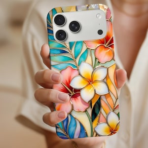 May include: A colourful phone case with a stained-glass floral design. The case features vibrant flowers in shades of red, pink, yellow, and white, with blue and green leaves. The case has a glossy finish and a camera cutout.