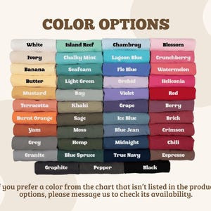 May include: A color chart displaying folded fabric swatches in various shades including white, ivory, yellow, orange, red, pink, purple, blue, green, grey, brown, and black. Each swatch is labeled with its corresponding color name in black text.