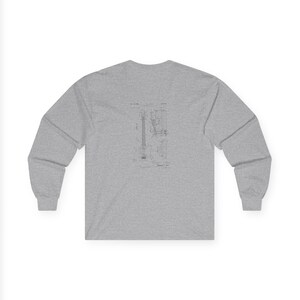 Unisex vintage guitar patent long sleeve tee with electric guitar blueprint in Fender-style patent art.