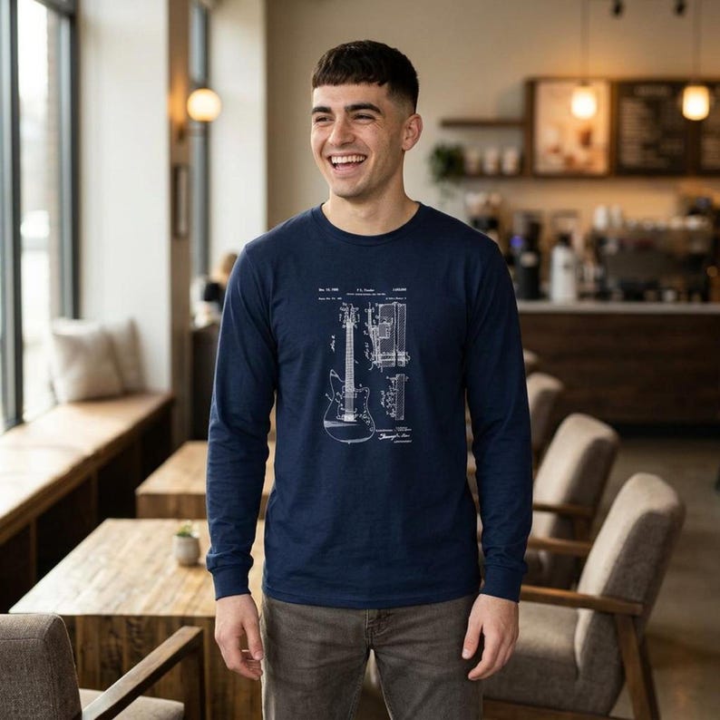 Unisex vintage guitar patent long sleeve tee with electric guitar blueprint in Fender-style patent art.