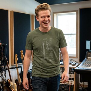 T-shirt with a vintage guitar blueprint patent drawing in a Fender-style diagram.