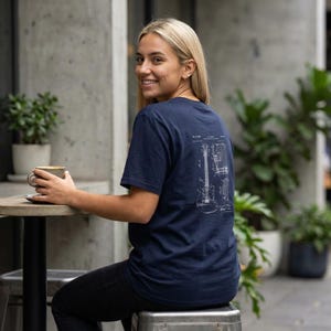 T-shirt with a vintage guitar blueprint patent drawing in a Fender-style diagram.