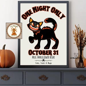 May include: A framed wall art print featuring a black cat with orange eyes and a wide grin. The text reads ONE NIGHT ONLY, OCTOBER 31, ALL HALLOWS EVE, and Tricks, Treats & Magic. A small spider graphic is centered below the date text.