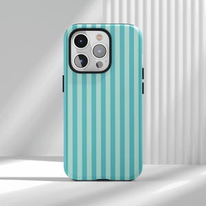 This Mint Green Vertical Stripe Phone Case is a fresh minimalist cover, featuring neat vertical stripes with healing mint green. It’s fresh, skin-friend and suitable for all skin tones, the minimalist design is high-end but not dull and visually slim and delicate. Made of flexible durable material, it’s drop and scratch-resistant, with raised camera bezels, precise cutouts, responsive buttons and wireless charging compatibility, ideal for minimalist style lovers.Come and buy it back home!