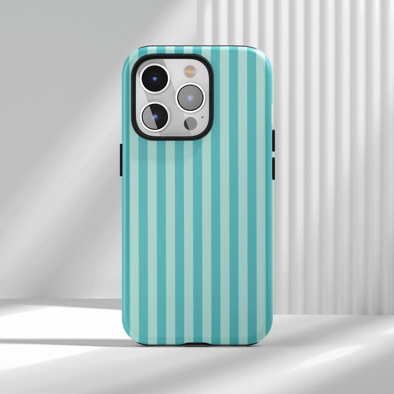 This Mint Green Vertical Stripe Phone Case is a fresh minimalist cover, featuring neat vertical stripes with healing mint green. It’s fresh, skin-friend and suitable for all skin tones, the minimalist design is high-end but not dull and visually slim and delicate. Made of flexible durable material, it’s drop and scratch-resistant, with raised camera bezels, precise cutouts, responsive buttons and wireless charging compatibility, ideal for minimalist style lovers.Come and buy it back home!