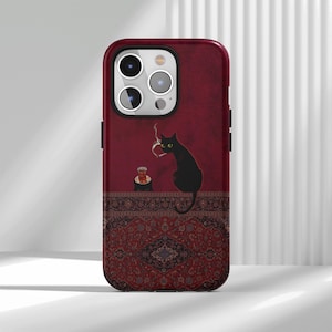 May include: A smartphone case featuring a deep red background with a black cat sitting on a patterned rug. The cat is holding a lit cigarette with smoke rising. Next to the cat is a small glass of tea on a saucer. The case has a camera cutout.