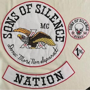 May include: Embroidered patches featuring the words "SONS OF SILENCE MC" and "NATION". The main patch has an eagle design with the words "Donec Mors Non Separat". Additional patches include a skull with a clown nose and the number "1%".
