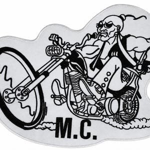 May include: A black and white embroidered patch featuring a cartoon character with a ponytail and sunglasses riding a chopper motorcycle. The character wears a vest and pants. The text M.C. is printed in bold black letters at the bottom of the patch.