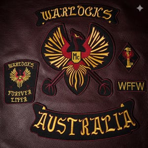May include: Embroidered patches on a burgundy leather background. The patches feature the words "Warlocks" and "Australia" in gold lettering. A central patch displays a stylized eagle with "Mc" and "Forever Lifer" text.