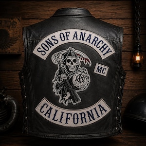 May include: Black leather vest with the "Sons of Anarchy" logo patch on the back. The patch features a grim reaper holding a scythe and a gun, with the words "California" and "MC" also visible.